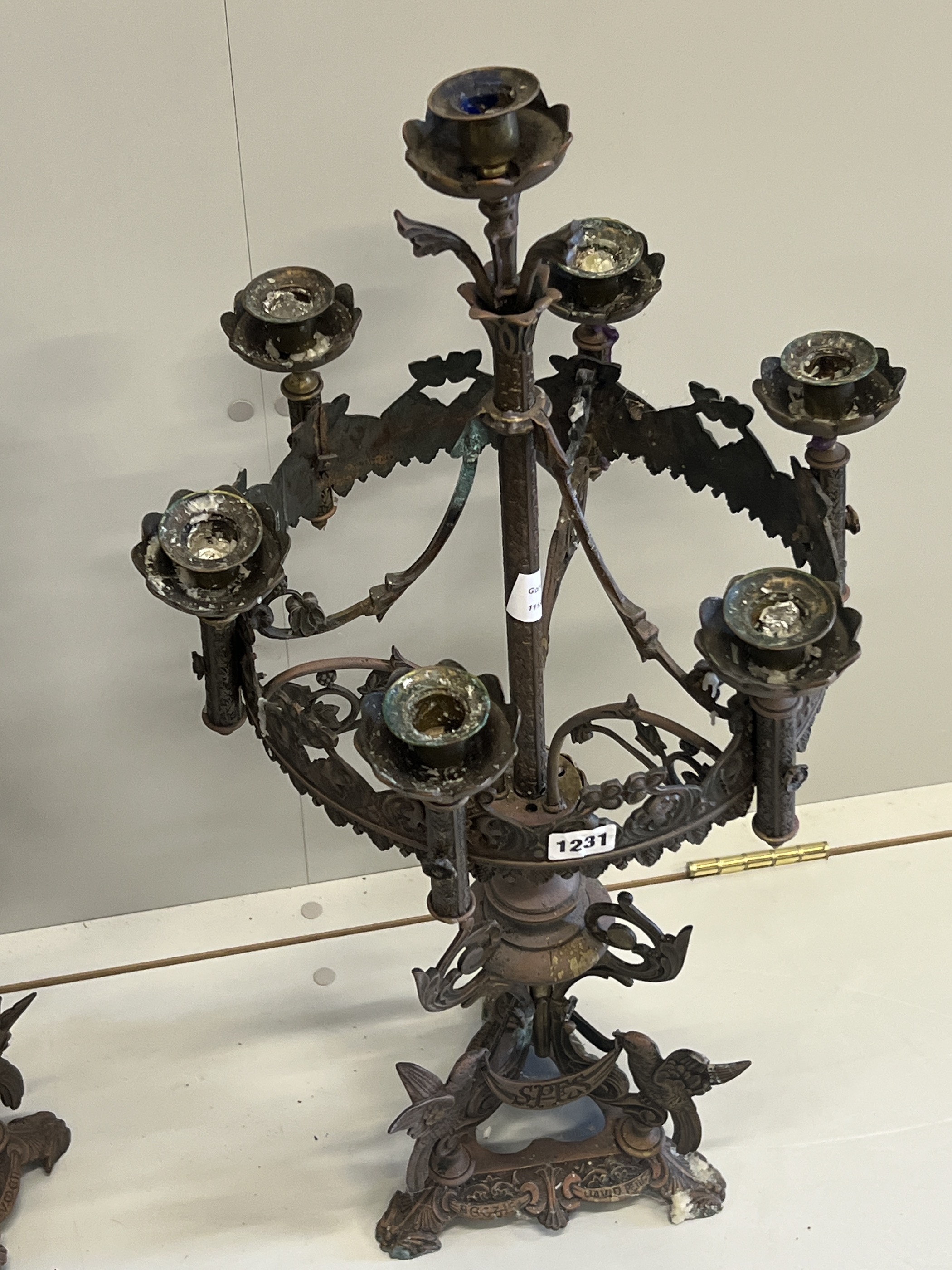 A pair of Gothic style seven branch cast metal candelabra, height 80cm